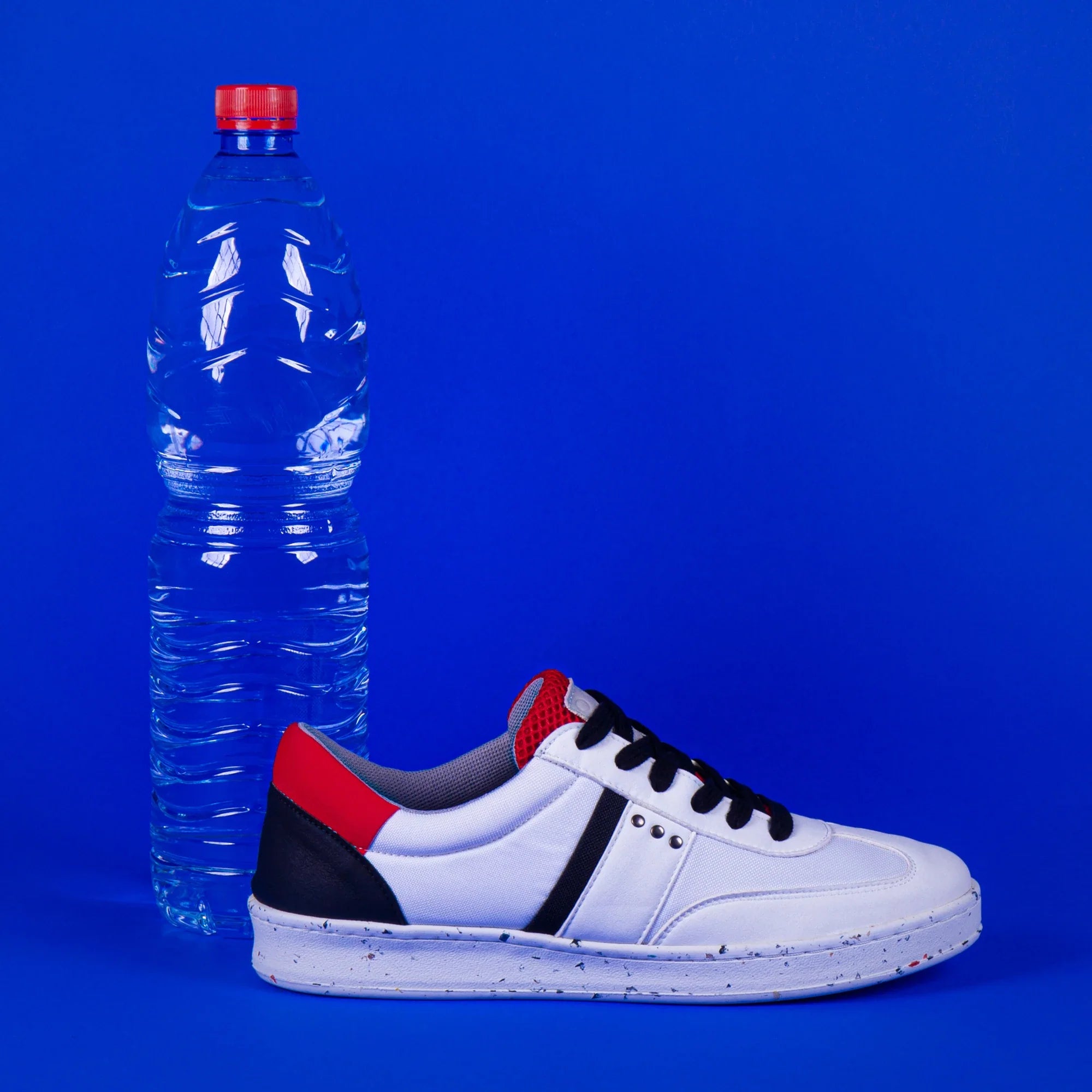 ME.LAND Vivace vegan and recycled sneaker in white, black and red above